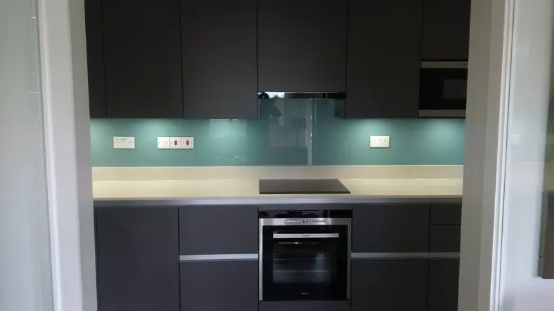 Kitchen refit with glass splashback and induction hob in Weybridge Surrey