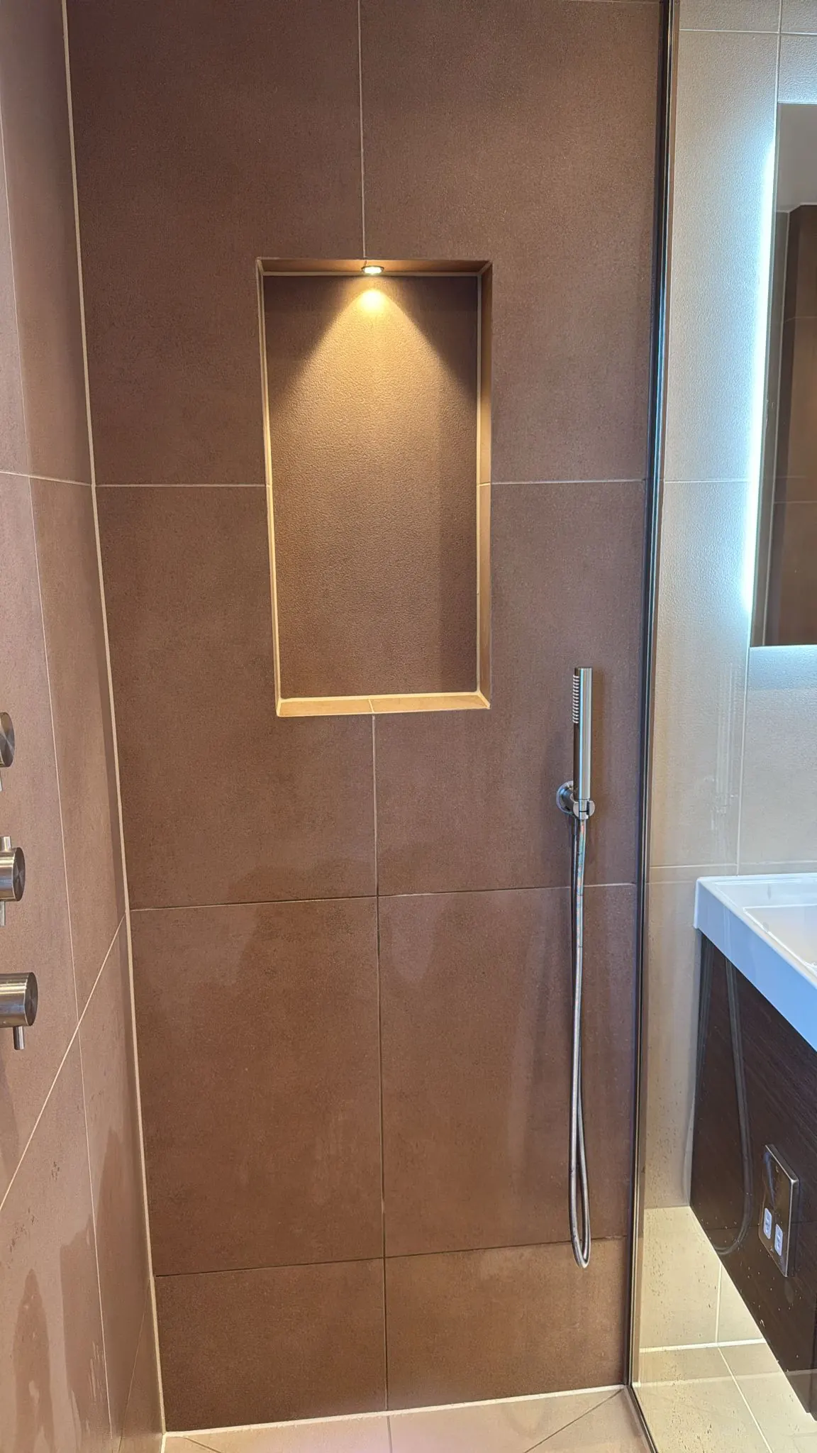 Shower wall tiling with niche feature Esher Surrey